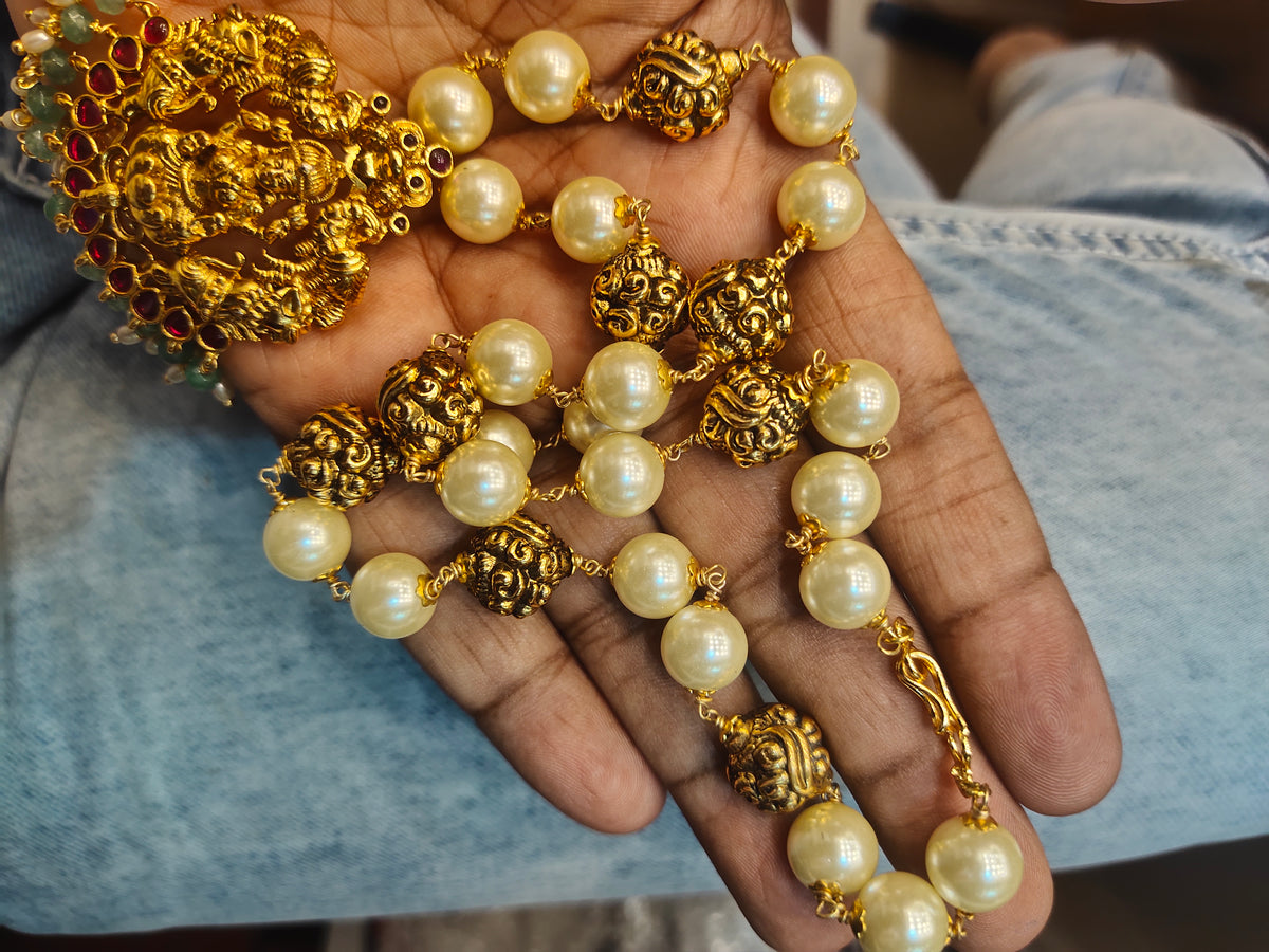 "Divine Elegance: Nagas Goddess Lakshmi Pendant Adorned with Pearl Chain"
