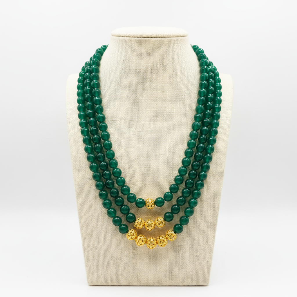 Green beaded necklace on mannequin