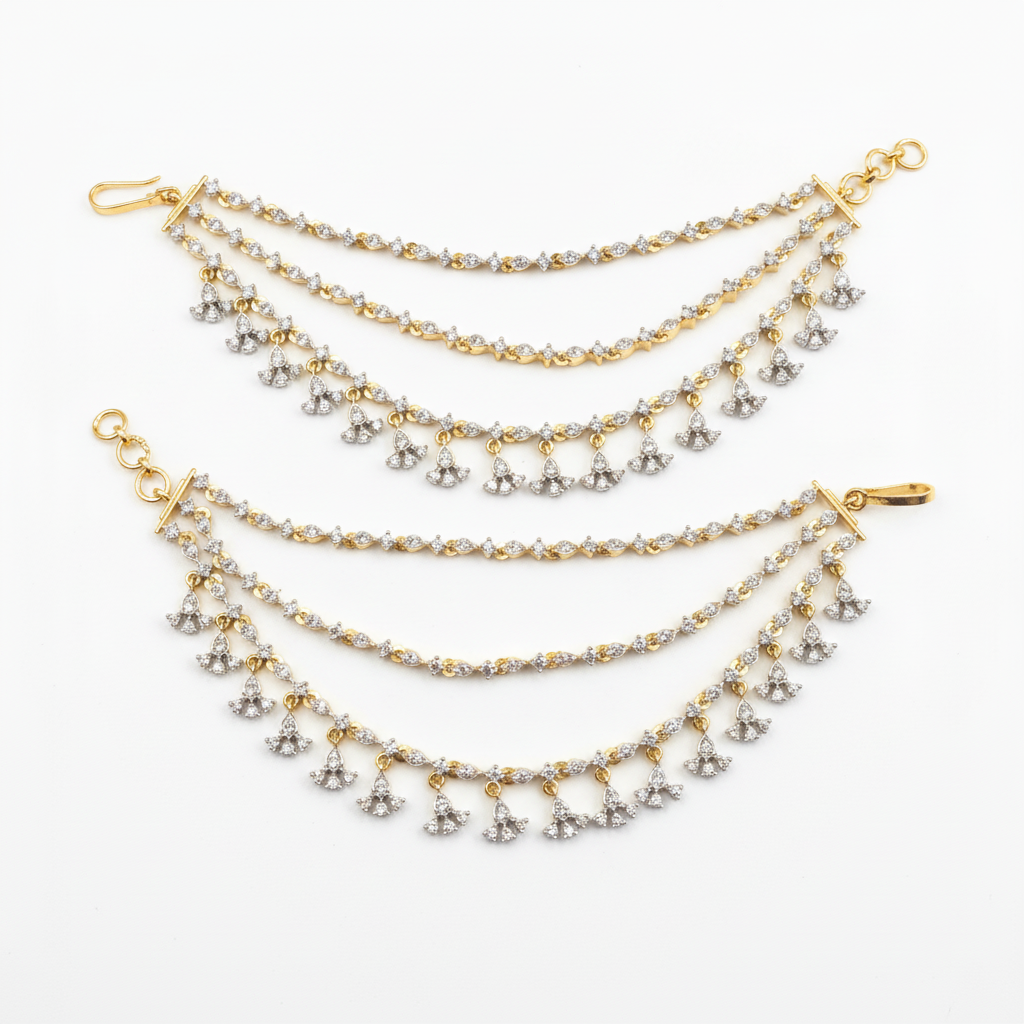 Gold-rhodium diamond ear chains on white background