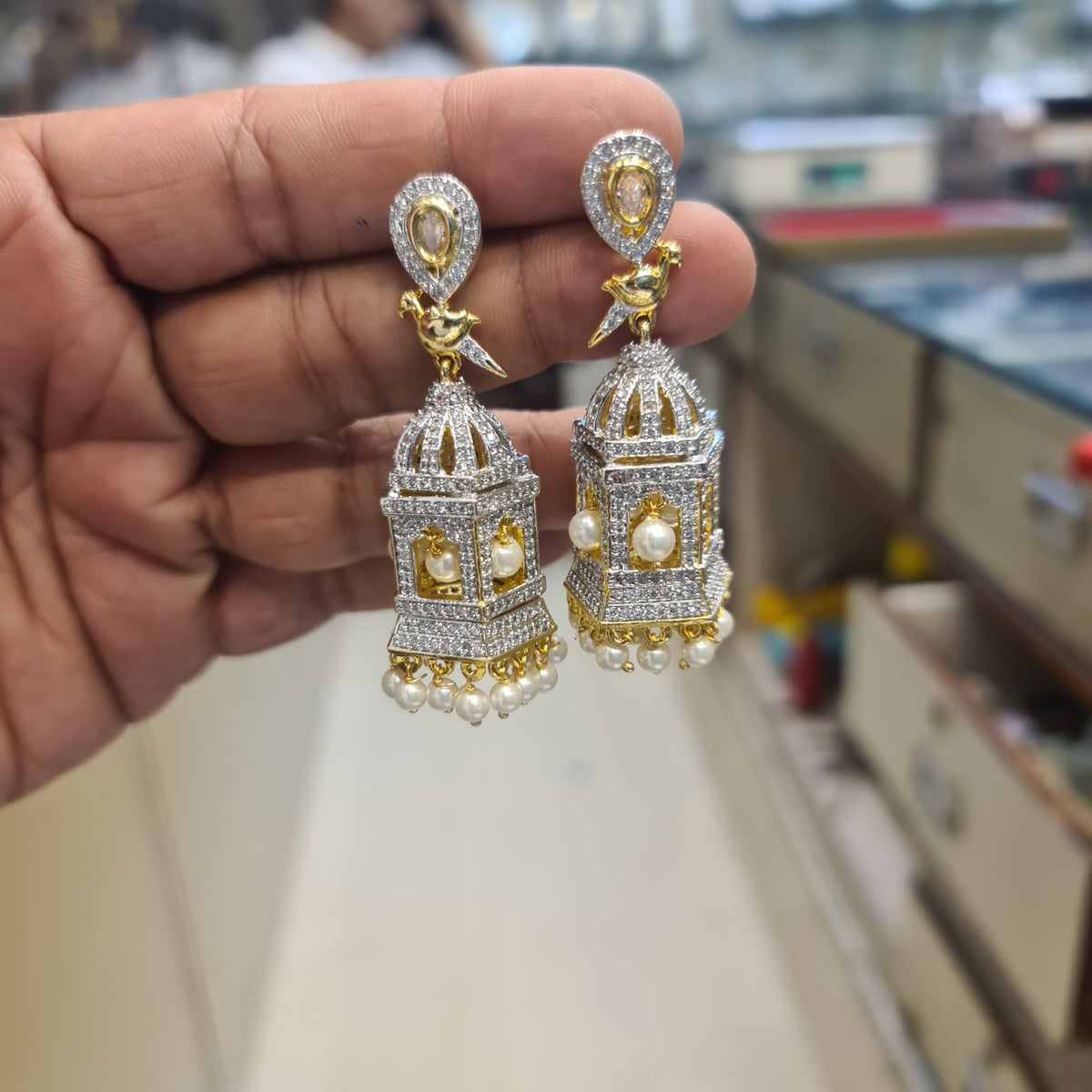 Temple Cage Jhumka Earrings โ Screw Back | CZ Diamond with Bird Motif