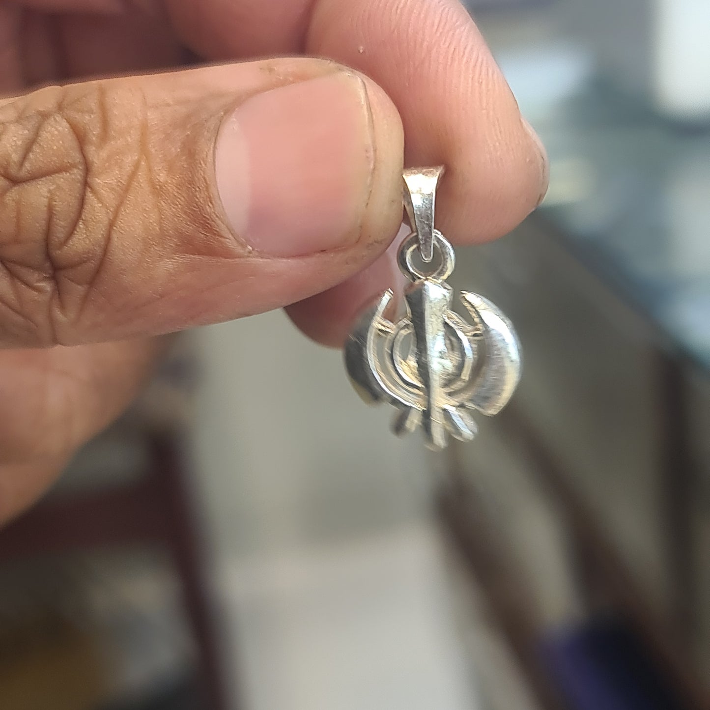 "Shine Brightly with the 92.5 Silver Baba Guru Nanak Khanda Symbol Pendant"