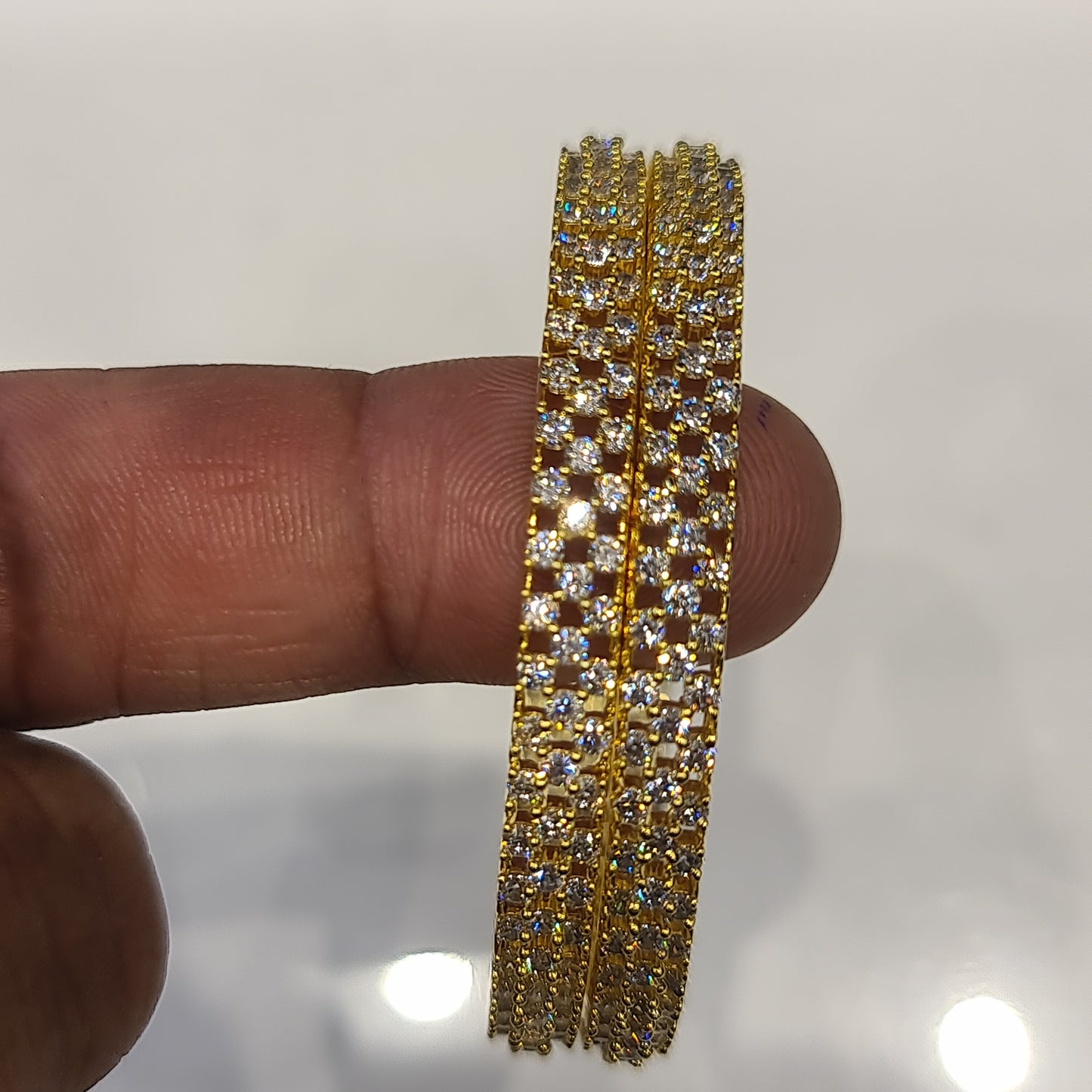 "Sparkle & Shine: Luxurious Gold-Plated American Diamond Baby Bangles"