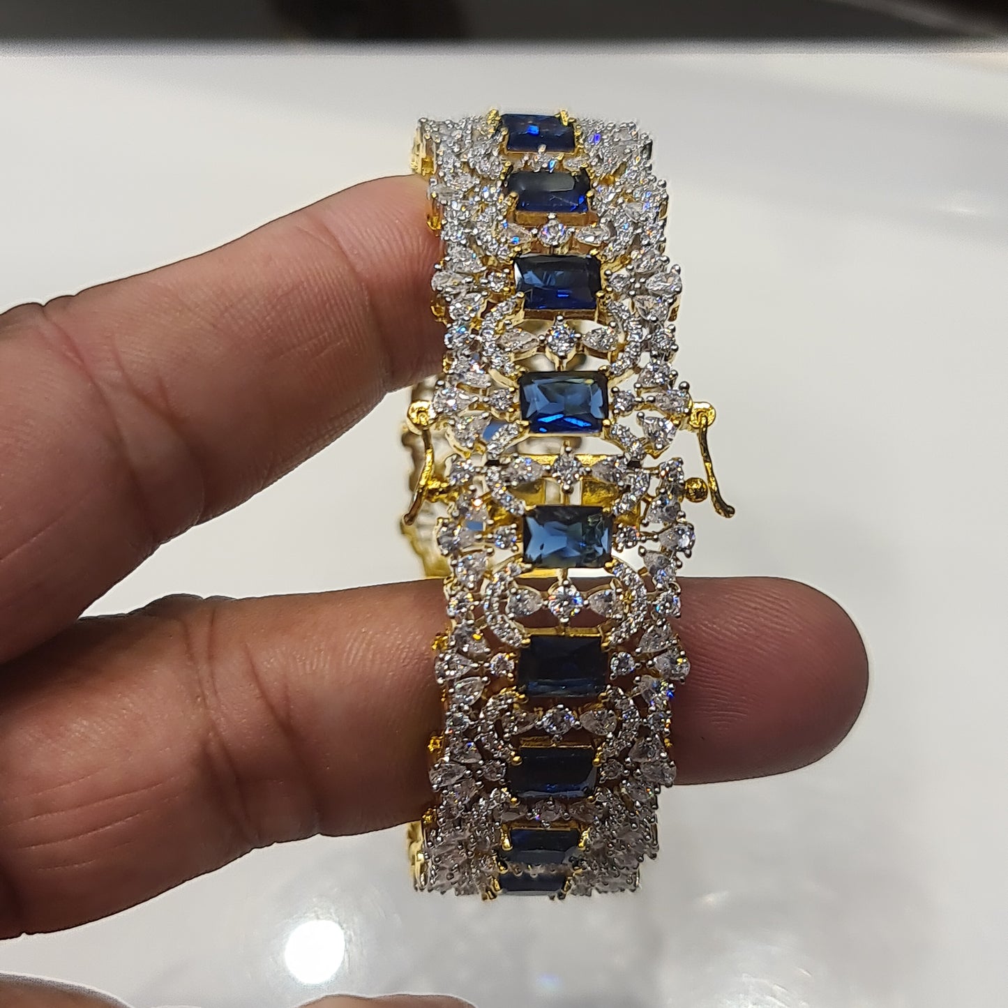 "Sparkle in Style: The Opulent Blue American Diamonds Bangles Set"