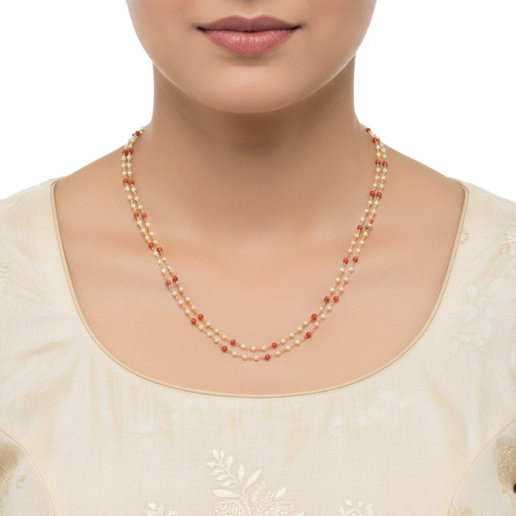 2-strand pearl and coral beaded necklace worn by model with cream kurta - lifestyle view