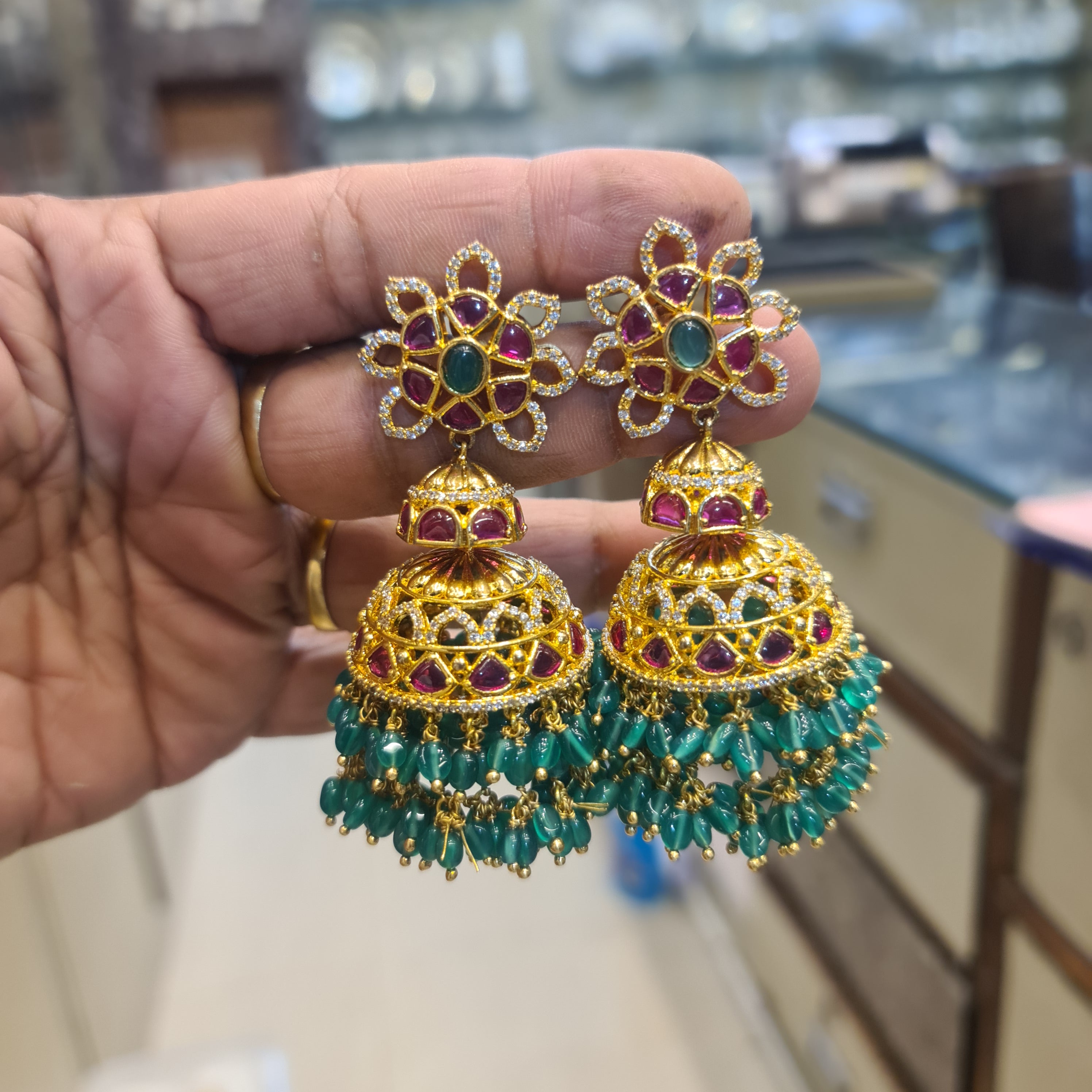 Kempu Emerald Jhumka Earrings with Green Bead Drops | Gold-Plated Temple Jewellery