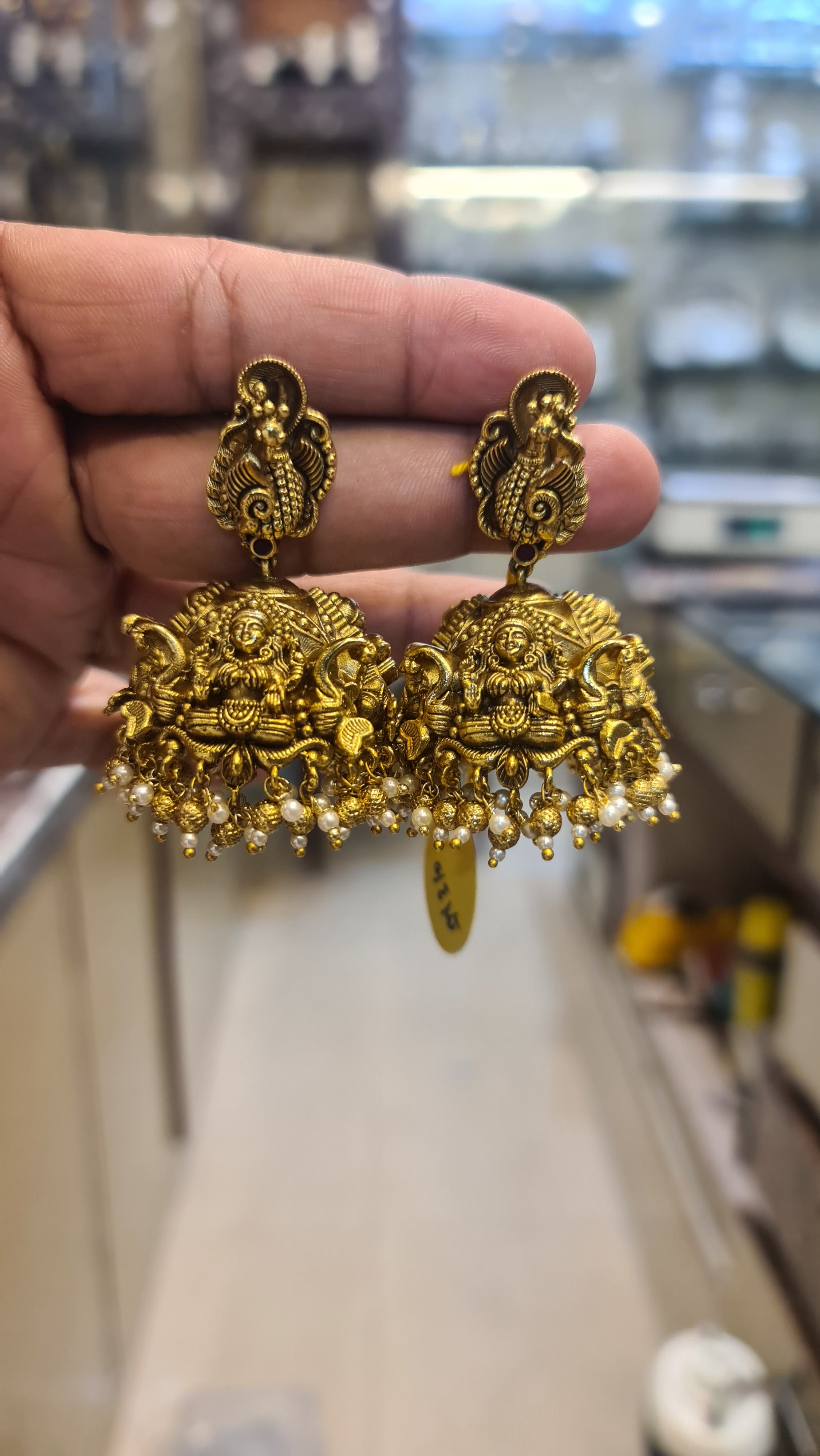 Antique Finish Lakshmi Temple Jhumka Earrings with Peacock Stud & Pearl Drops