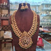 Lakshmi Temple Haram Long Necklace Set with Jhumka Earrings - Antique Gold with Ruby and Emerald Beads