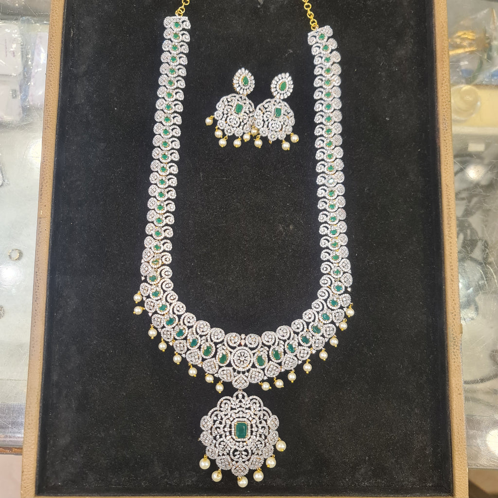 CZ Diamond Finish Emerald Long Haram Necklace Set | Screw-Back Chandbali | Gold Plated