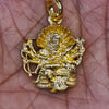 Panchaloham Narasimha Swami pendant held in hand showing gold finish and intricate deity detailing