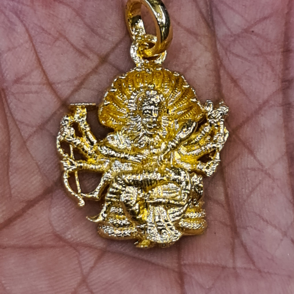 Panchaloham Narasimha Swami pendant held in hand showing gold finish and intricate deity detailing