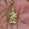 Panchaloham Dakshinamurthy pendant held in hand showing gold finish and intricate seated deity detailing