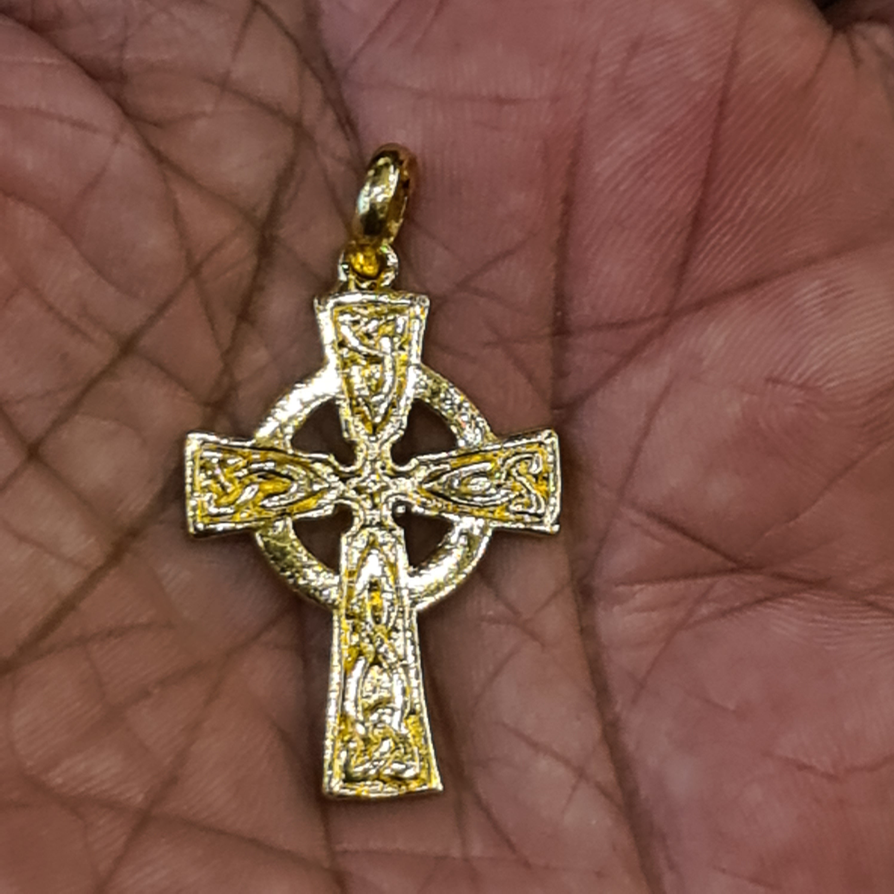 Panch Loham Celtic Cross Locket held in palm
