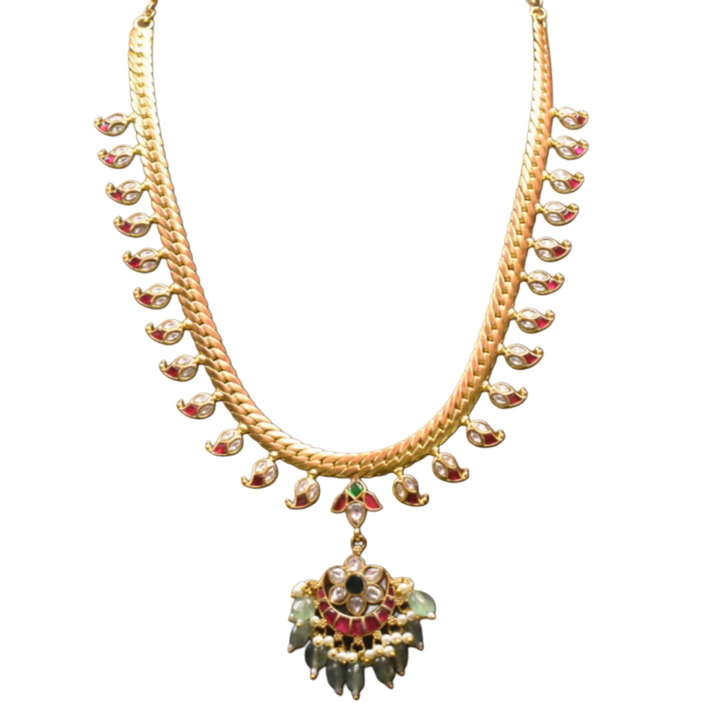 Gold necklace with colorful pendant on a white background