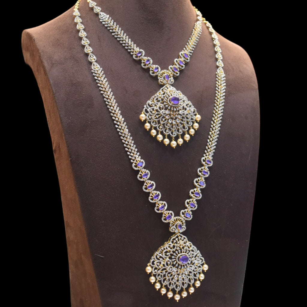 Ornate necklace with purple gemstones on a mannequin bust against a black background