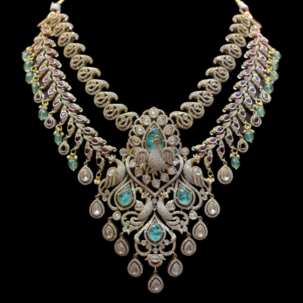 Ornate necklace with gemstones on a black background