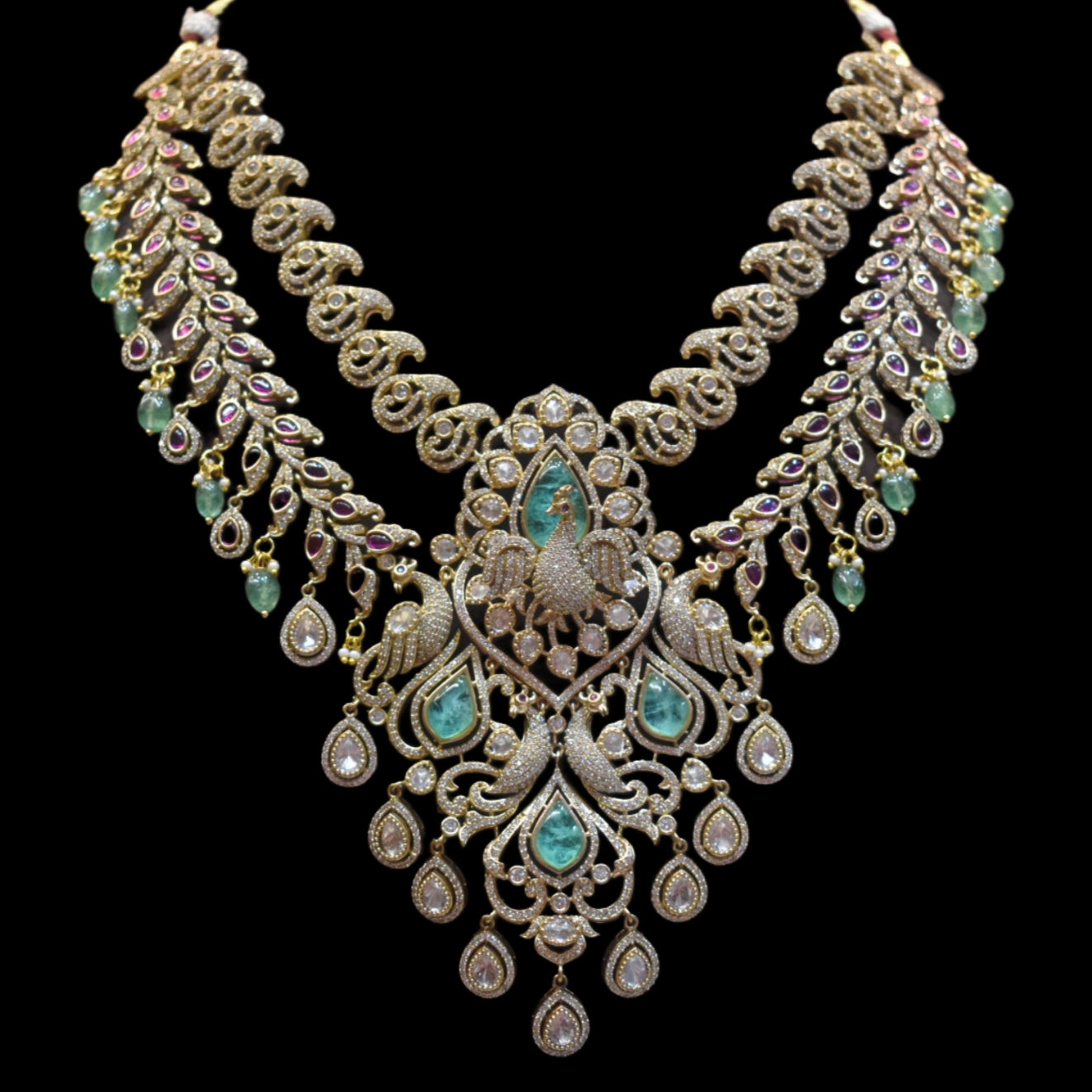 Ornate necklace with gemstones on a black background
