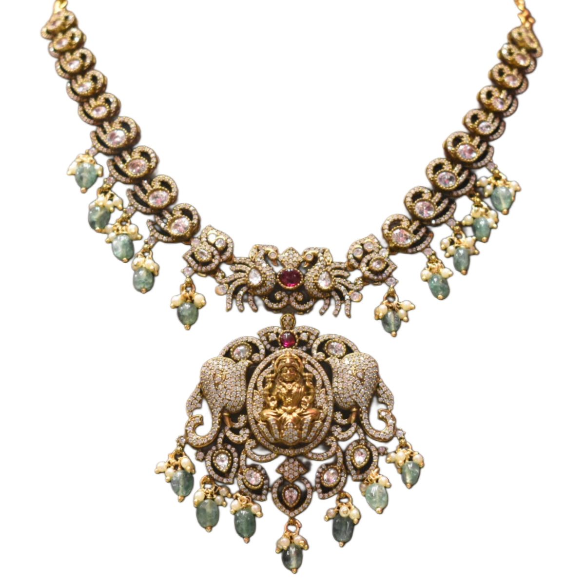Ornate necklace with gemstones on a white background