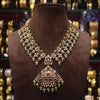 Ornate necklace on a brown mannequin with a blurred jewelry store background