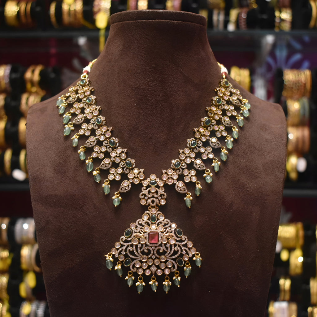Ornate necklace on a brown mannequin with a blurred jewelry store background