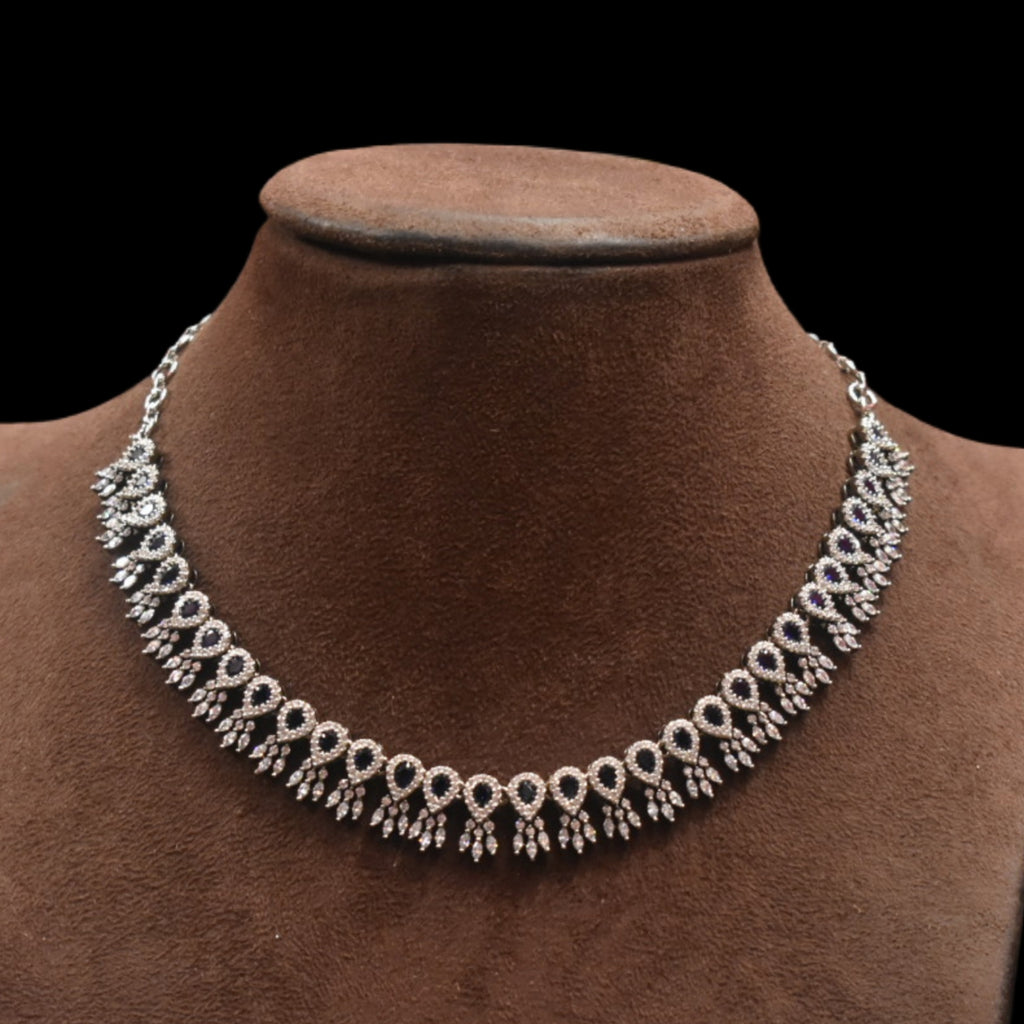 Necklace on a brown velvet mannequin against a black background