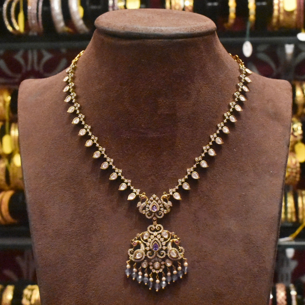 Ornate necklace on a brown mannequin bust with blurred jewelry store background