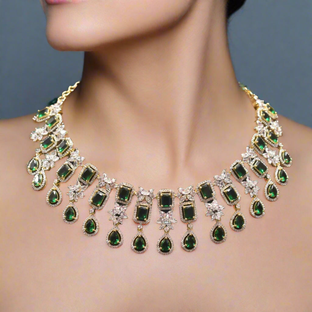 Elegant green and silver necklace on a brown velvet stand with blurred background