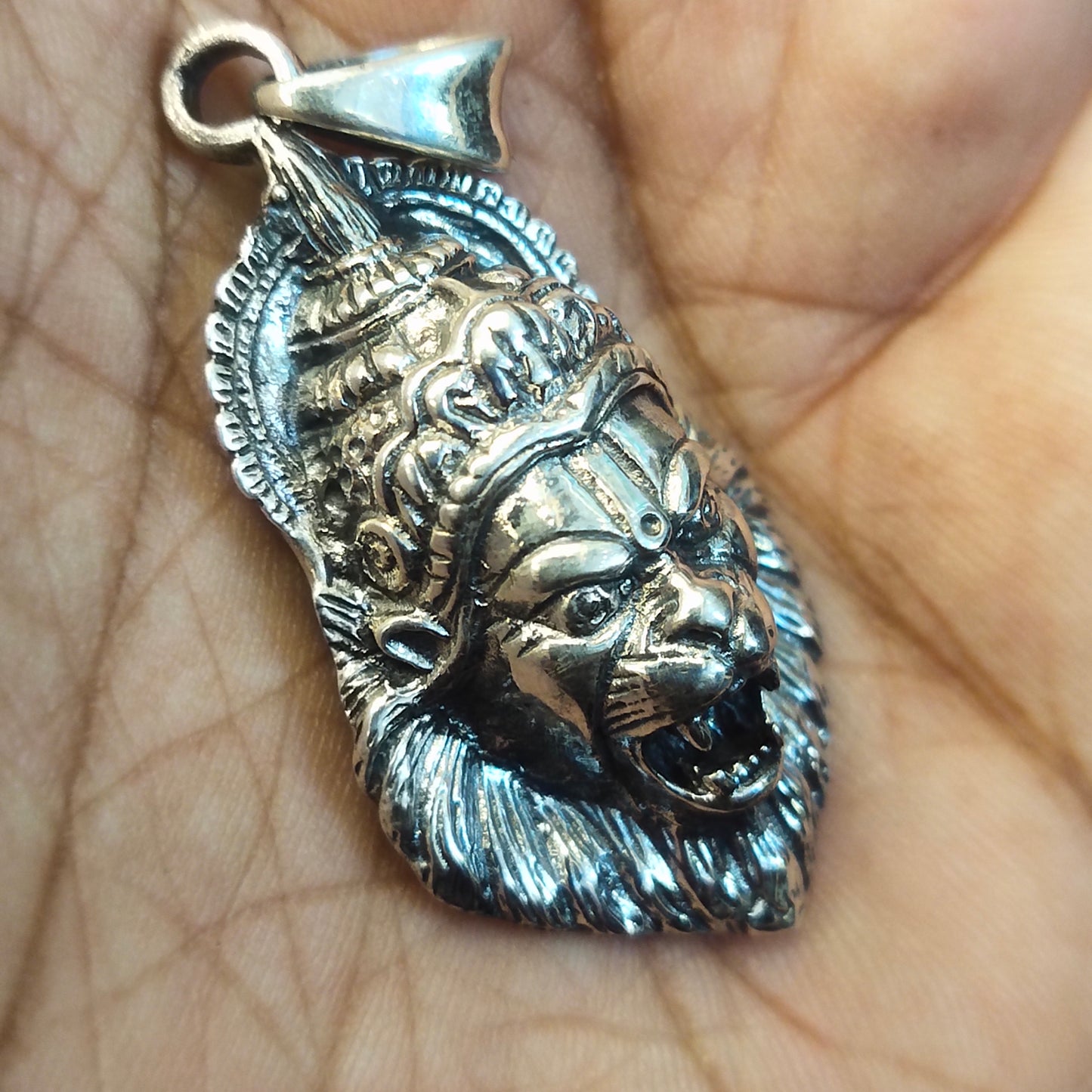 "The Majestic Lord Narasimha: A Sterling Silver Pendant to Embrace Your Devotion"