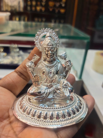 "Shining Symbol of Grace: The Silver Lakshmi Idol"