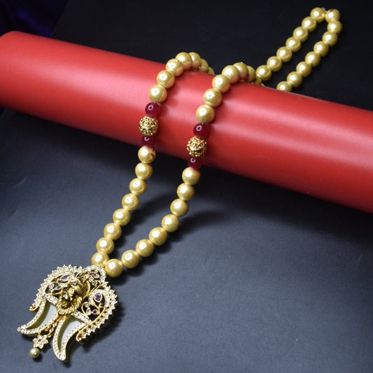 "Timeless Elegance: Antique Narsimha Swami Puligoru Pendant Adorned with Pearls"