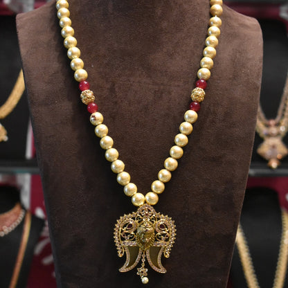 "Timeless Elegance: Antique Narsimha Swami Puligoru Pendant Adorned with Pearls"