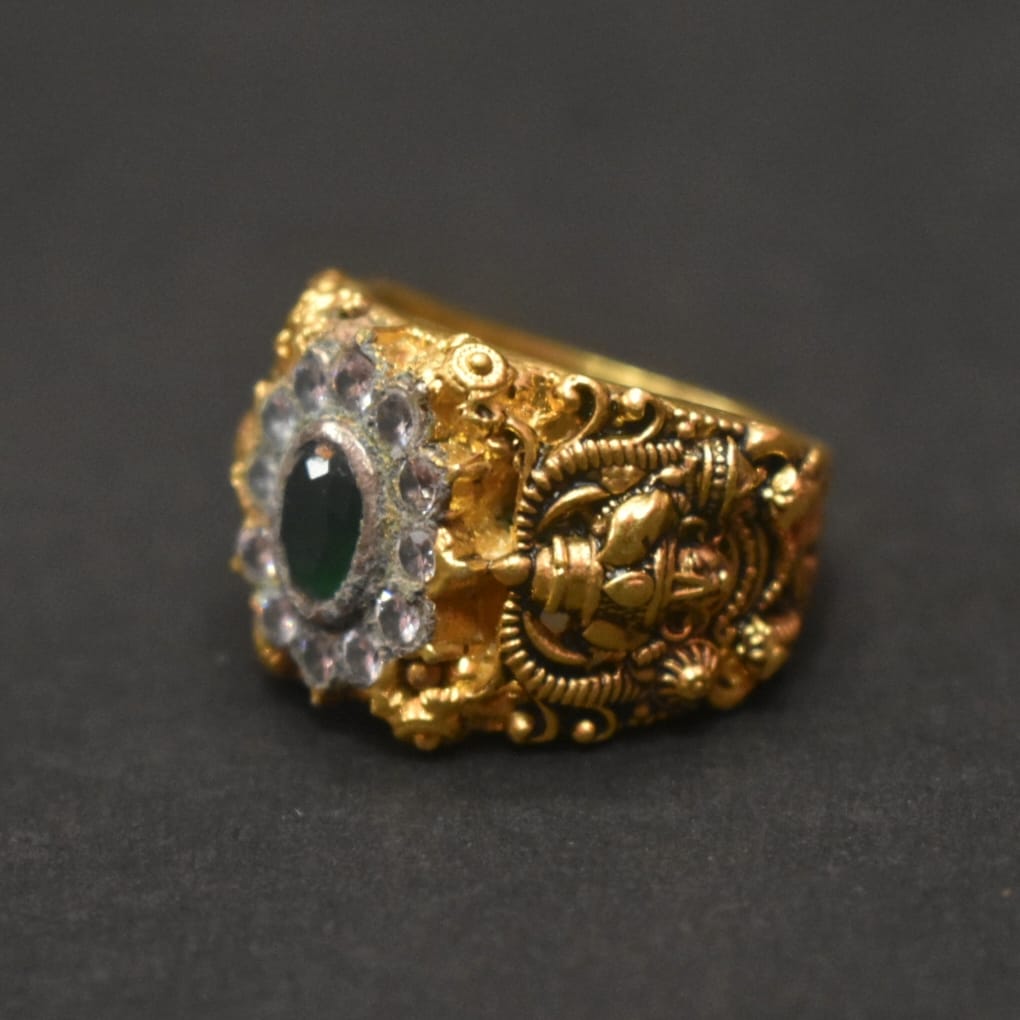 Shine Bright with the 92.5 Silver Gold-Plated Venkateswara Swami Ring Adorned with Emerald