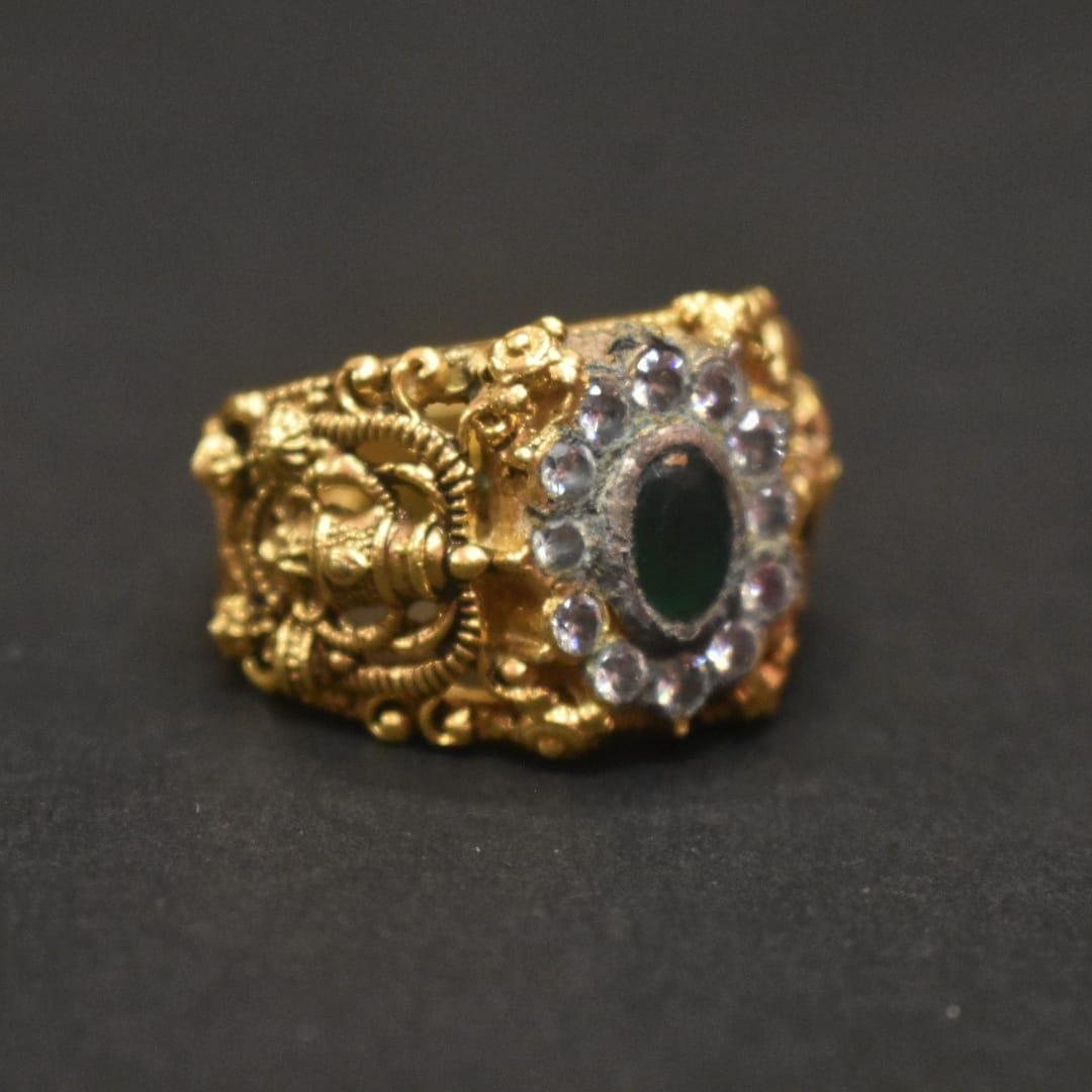 Shine Bright with the 92.5 Silver Gold-Plated Venkateswara Swami Ring Adorned with Emerald