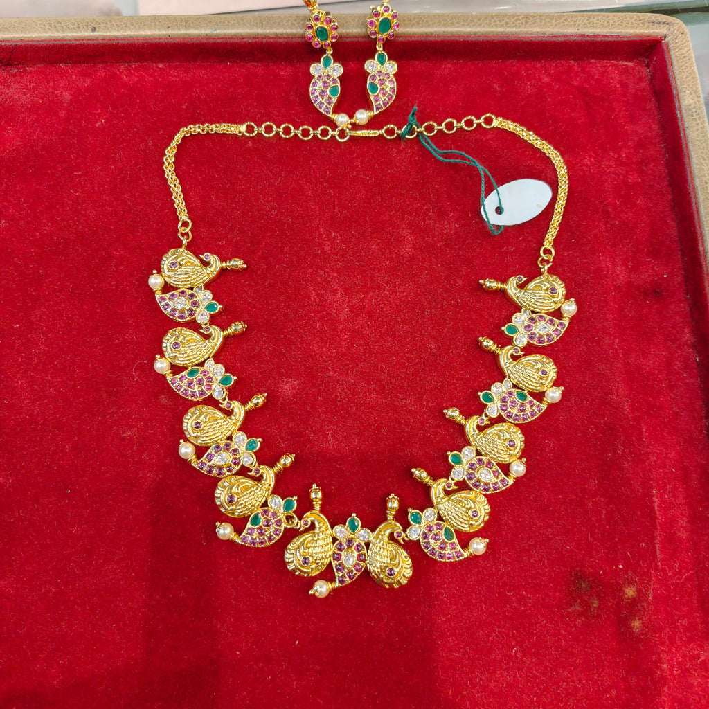 Kempu mango peacock necklace set on red velvet box - product view