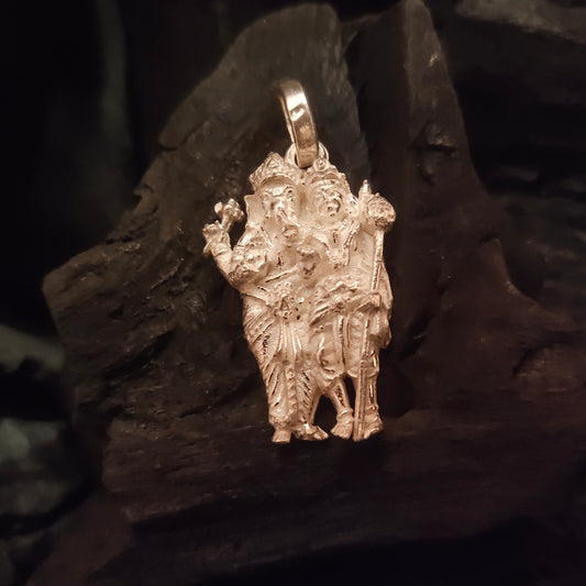 A silver locket featuring an image of Ganesh and Karthikeyan on a dark, textured background.