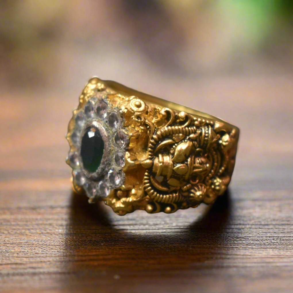 Shine Bright with the 92.5 Silver Gold-Plated Venkateswara Swami Ring Adorned with Emerald