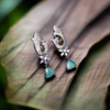 "Enchanting Elegance: Silver-Tone Pastel Green American Diamond Earrings by Asp Fashion"