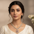 Elegant model wearing delicate peacock necklace