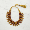 Flat lay antique gold ruby temple necklace