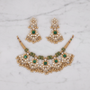 Flat lay gold Kundan emerald choker necklace set