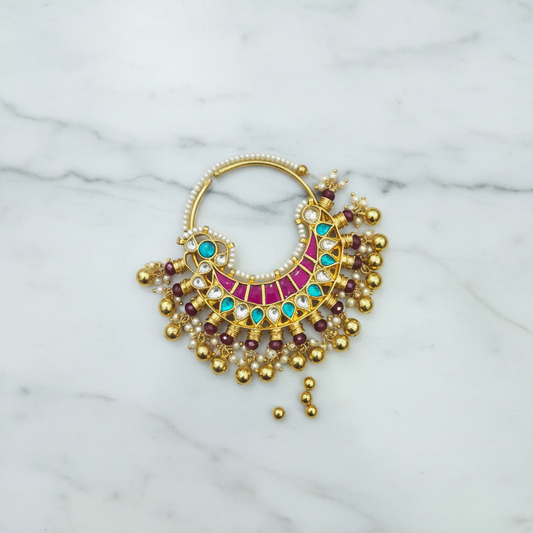 Flat lay of kundan nath nose ring
