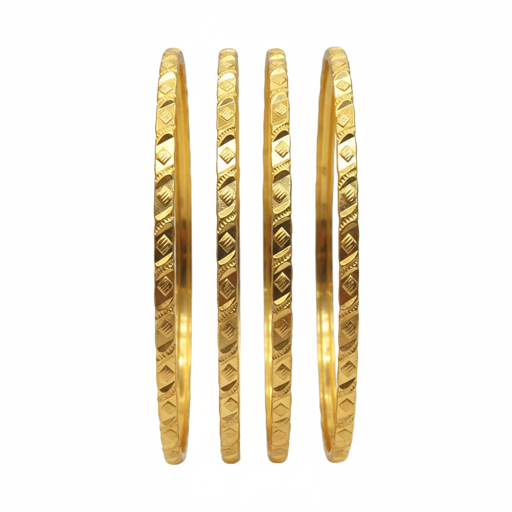 Four gold bangles on white background
