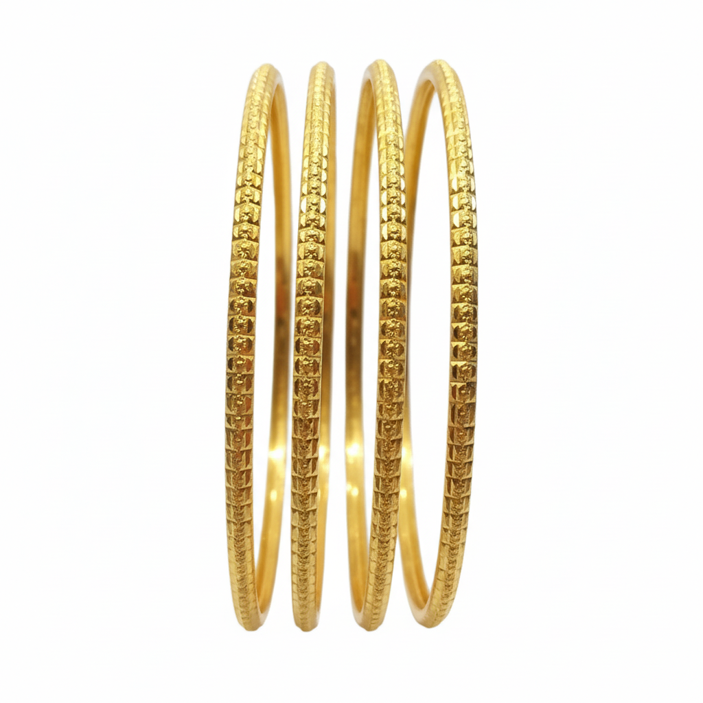 Gold bangles on white background