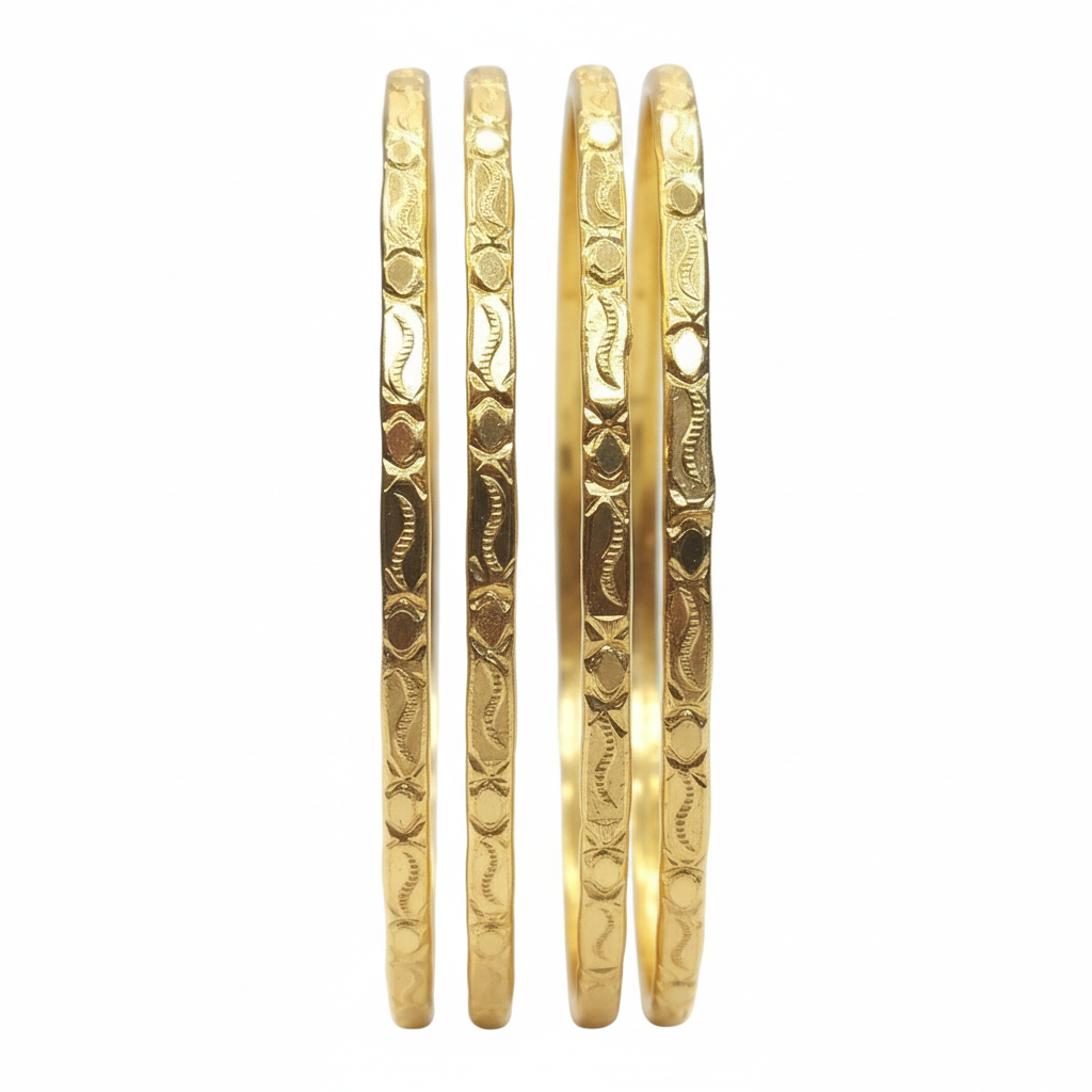 Gold bangles on white background