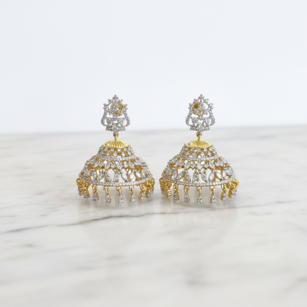 Gold CZ Jhumka Earrings on White Marble