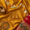 Gold Filigree Jhumka Flat Lay - Cultural Context