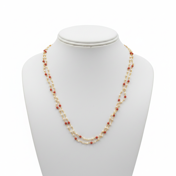 2-strand pearl and coral beaded necklace on white mannequin bust - front view