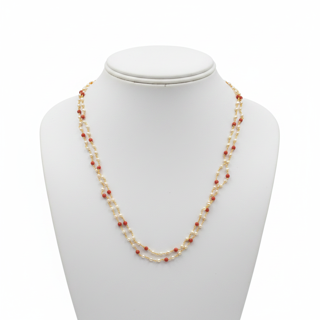 2-strand pearl and coral beaded necklace on white mannequin bust - front view
