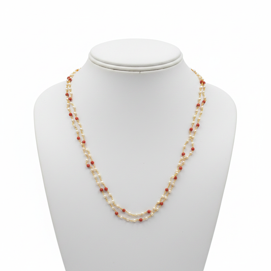2-strand pearl and coral beaded necklace on white mannequin bust - front view