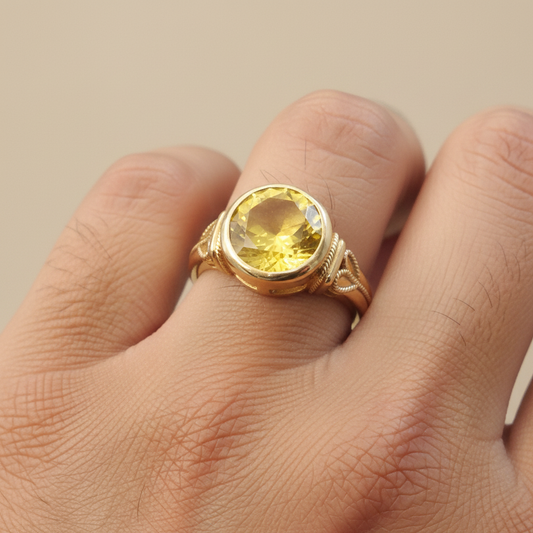 Gold Ring with Yellow Stone on Man's Hand