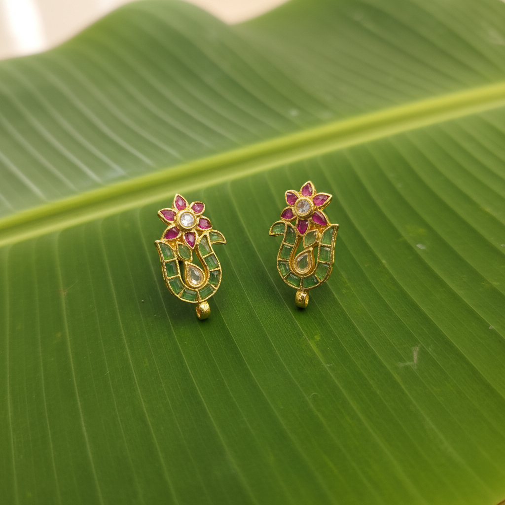 Handmade Emerald Peacock Stud Earrings banana leaf flat lay